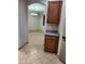 Kitchen featuring tiled floors, breakfast nook, and plentiful cabinet storage space at 337 S 172Nd Dr, Goodyear, AZ 85338