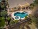 A relaxing backyard with a custom in ground pool and patio perfect for enjoying the Arizona weather at 3546 E Latham Way, Gilbert, AZ 85297