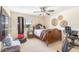 Bedroom featuring a bed, TV, and exercise equipment, providing space for rest and wellness at 3546 E Latham Way, Gilbert, AZ 85297