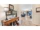 Inviting entryway with wood console table, decorative accents, and a glimpse into the open living areas at 3546 E Latham Way, Gilbert, AZ 85297