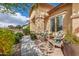 Charming home exterior featuring a cozy seating area on the porch with lush landscaping at 3546 E Latham Way, Gilbert, AZ 85297