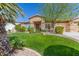 Inviting home with well-maintained lawn, mature trees, and attractive landscaping at 3546 E Latham Way, Gilbert, AZ 85297