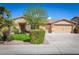 Beautiful home exterior featuring a manicured lawn, mature trees, and a three-car garage at 3546 E Latham Way, Gilbert, AZ 85297