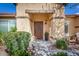 Inviting front entry with a decorative wreath on the door and a well-manicured garden at 3546 E Latham Way, Gilbert, AZ 85297