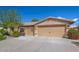 Home exterior highlighting a three-car garage with a spacious driveway and well-kept landscaping at 3546 E Latham Way, Gilbert, AZ 85297