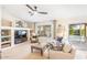 Comfortable living room with built-in shelving, neutral colors, and sliding glass doors that provide views of the backyard at 3546 E Latham Way, Gilbert, AZ 85297