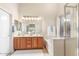 Bright primary bathroom with double vanities, soaking tub, and ample natural light from the window at 3546 E Latham Way, Gilbert, AZ 85297