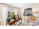 Well-lit office featuring a wooden desk, decorative lamps, and a marble-topped cabinet at 3546 E Latham Way, Gilbert, AZ 85297