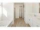 Bright bathroom featuring a separate tub, and a glass-enclosed shower at 3764 N Camden Dr, Florence, AZ 85132