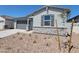 Charming single-story home with neutral stucco, stone accents, gray shutters, and well-maintained desert landscaping at 3764 N Camden Dr, Florence, AZ 85132