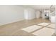 Spacious living room with tile floors, stainless appliances, white walls and baseboards at 3764 N Camden Dr, Florence, AZ 85132