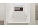 A relaxing bathroom with a large soaking tub next to a window and tile shower at 3782 N Camden Dr, Florence, AZ 85132