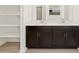 Bathroom with dual sinks, dark wood cabinets, and a spacious vanity area for added convenience at 3782 N Camden Dr, Florence, AZ 85132