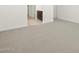 This bedroom features neutral walls and carpet, as well as a bathroom connected to the side at 3782 N Camden Dr, Florence, AZ 85132