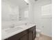 Modern bathroom featuring a double sink vanity, bright lighting, and a clean design with a shower and toilet at 3864 N Camden Dr, Florence, AZ 85132