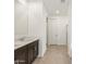 Bathroom with dual vanity, walk in shower and fresh light paint at 3864 N Camden Dr, Florence, AZ 85132