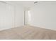 Spacious bedroom features plush carpeting, ample closet space with sliding doors, and neutral décor for versatile styling at 3864 N Camden Dr, Florence, AZ 85132