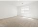 Bright bedroom with neutral carpet, a window and fresh paint at 3864 N Camden Dr, Florence, AZ 85132