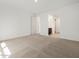 Bedroom with neutral carpet, walk in closet, and entry to bathroom at 3864 N Camden Dr, Florence, AZ 85132