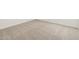Close-up of plush, neutral-toned carpeting, offering a soft and comfortable foundation for any interior space in the home at 3864 N Camden Dr, Florence, AZ 85132