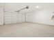 Spacious two car garage with opener, hot water tank, and sealed concrete flooring at 3864 N Camden Dr, Florence, AZ 85132