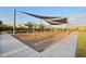 Spacious playground with shade structure and swings, providing a safe and fun environment for children at 4097 E Tonto Pl, Chandler, AZ 85249