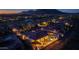 Dramatic aerial view of a community home with a pool and golf course, set against a backdrop of serene mountains at 41413 N Club Pointe Dr, Anthem, AZ 85086