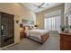 The bedroom boasts a sauna, plantation shutters, and a comfortable bed at 41413 N Club Pointe Dr, Anthem, AZ 85086