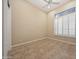 Small secondary bedroom featuring tile floors and bright white shutters on the windows at 41413 N Club Pointe Dr, Anthem, AZ 85086