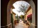 Beautiful courtyard with stone accents, lush greenery, and serene desert views at 41413 N Club Pointe Dr, Anthem, AZ 85086