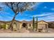 Charming home featuring desert landscaping, a stone facade, a three car garage and a welcoming entrance at 41413 N Club Pointe Dr, Anthem, AZ 85086