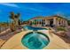 A backyard pool and spa surrounded by desert landscaping and expansive views at 41413 N Club Pointe Dr, Anthem, AZ 85086