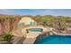 A backyard with a pool and spa combo complemented by desert views at 41413 N Club Pointe Dr, Anthem, AZ 85086