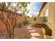 A landscaped side yard featuring desert plants and stone pathways at 41413 N Club Pointe Dr, Anthem, AZ 85086