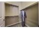 A walk-in closet with built-in shelving and a hanging gray robe at 41413 N Club Pointe Dr, Anthem, AZ 85086