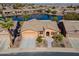 Aerial view of home featuring desert landscaping, well maintained lawn, and community lake at 42432 W North Star Dr, Maricopa, AZ 85138