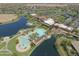 Beautiful aerial shot of community amenities including pools, lakes, and clubhouse at 42432 W North Star Dr, Maricopa, AZ 85138