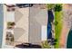 Aerial view of home showing roof detail, landscaping, and proximity to lake at 42432 W North Star Dr, Maricopa, AZ 85138