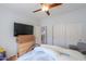 This bedroom features built-in closet space and neutral paint at 42432 W North Star Dr, Maricopa, AZ 85138