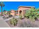 Attractive home with desert landscaping, showcasing a beautiful combination of textures and colors at 42432 W North Star Dr, Maricopa, AZ 85138