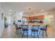 Kitchen with granite countertop island and breakfast bar seating and stainless steel appliances at 42432 W North Star Dr, Maricopa, AZ 85138