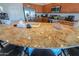 Kitchen island with granite countertop, seating and stainless steel appliances at 42432 W North Star Dr, Maricopa, AZ 85138