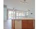 Bright kitchen with granite countertops, an island, and views of the backyard pond at 42432 W North Star Dr, Maricopa, AZ 85138
