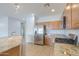 Spacious kitchen with a granite island, stainless steel appliances and ample cabinet storage at 42432 W North Star Dr, Maricopa, AZ 85138