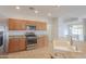 Well-equipped kitchen featuring stainless steel appliances, granite counters, and a kitchen island at 42432 W North Star Dr, Maricopa, AZ 85138