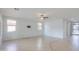 Living room with tile flooring, neutral paint, and ample natural light at 42432 W North Star Dr, Maricopa, AZ 85138