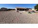 Expansive backyard with desert landscaping and patio area, perfect for outdoor entertaining at 4511 S 181St Ave, Goodyear, AZ 85338