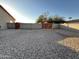 Fenced backyard with gravel ground cover at 4511 S 181St Ave, Goodyear, AZ 85338