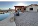 A backyard pergola, pool, and seating area offers relaxation and entertainment at 4511 S 181St Ave, Goodyear, AZ 85338