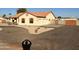 Charming single-Gathering home with a terracotta-colored roof, dual garage doors, and desert landscaping for low maintenance at 4511 S 181St Ave, Goodyear, AZ 85338